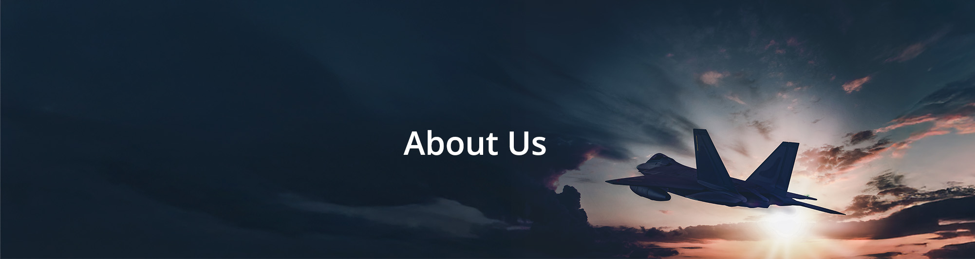 a plane flying into a sunset making the plane appear as a silhouette with the text 'About Us' next to the door
